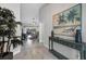 Open foyer with tiled floor, decorative console table, leads to the living room at 170 Long Meadow Ln, Rotonda West, FL 33947