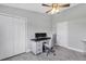 Functional home office featuring a wall bed, stylish desk, ergonomic chair and bright window at 170 Long Meadow Ln, Rotonda West, FL 33947