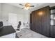 Functional home office featuring a wall bed, stylish desk, ergonomic chair and bright window at 170 Long Meadow Ln, Rotonda West, FL 33947