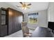 Functional home office featuring a wall bed, stylish desk, ergonomic chair and bright window at 170 Long Meadow Ln, Rotonda West, FL 33947