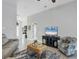 Relaxing living room with modern furniture and view to the front entryway at 170 Long Meadow Ln, Rotonda West, FL 33947