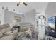 Inviting living room with comfortable seating and open view to the foyer at 170 Long Meadow Ln, Rotonda West, FL 33947