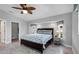 Bedroom with stylish ceiling fan, ensuite closet and bright windows at 170 Long Meadow Ln, Rotonda West, FL 33947
