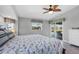 Large main bedroom with pool access, fan, and tiled floors at 170 Long Meadow Ln, Rotonda West, FL 33947