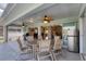 Covered outdoor patio with dining area, grill, refrigerator and easy indoor/outdoor access, perfect for entertaining at 170 Long Meadow Ln, Rotonda West, FL 33947
