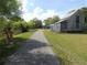 Well-maintained walking path near wooden structure for outdoor recreation and enjoyment at 18198 Griffen Ave, Port Charlotte, FL 33948