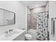 This bathroom offers a tub, shower, and well-lit vanity with modern features at 18575 Midsummer Pl, Venice, FL 34293