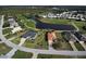 Overhead image displaying a single-Gathering home near a water feature and golf course at 19 Windward Rd, Placida, FL 33946