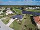 Aerial view of the house, lake, and community golf course at 19 Windward Rd, Placida, FL 33946