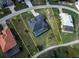 Aerial view showing the property lines of a home with a screened-in pool and well-maintained lawn at 19 Windward Rd, Placida, FL 33946