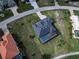 A high-angle aerial view showcases the property's landscaping, pool, and neighborhood layout at 19 Windward Rd, Placida, FL 33946