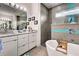 Modern bathroom with dual sinks, freestanding tub, and glass enclosed shower with blue tile at 19 Windward Rd, Placida, FL 33946