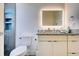 Modern bathroom features a lighted mirror, granite countertop, and tiled walk-in shower at 19 Windward Rd, Placida, FL 33946