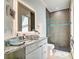 Well decorated bathroom featuring a modern sink with granite counters, updated fixtures, and tiled shower at 19 Windward Rd, Placida, FL 33946