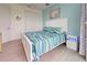 Bedroom with coastal décor, light blue walls, light floors, and modern nightstand at 19 Windward Rd, Placida, FL 33946