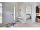 Bright entryway features coastal decor, a white console table and a view into a bedroom at 19 Windward Rd, Placida, FL 33946