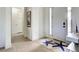 Clean, contemporary entryway with starfish rug, white walls, and light colored flooring at 19 Windward Rd, Placida, FL 33946