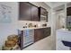 A bar area in the kitchen featuring a wine cooler and modern appliances at 19 Windward Rd, Placida, FL 33946