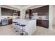 Spacious modern kitchen with a center island, stainless appliances, and dark cabinetry at 19 Windward Rd, Placida, FL 33946