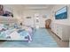 Spacious bedroom features stylish decor, light colored flooring, and a flat screen TV at 19 Windward Rd, Placida, FL 33946