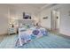 Bright main bedroom features coastal decor, accent rug, and large windows at 19 Windward Rd, Placida, FL 33946