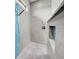 Elegant shower with grey tiling, mosaic accents, and a glass enclosure at 19 Windward Rd, Placida, FL 33946
