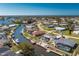 Waterfront home featuring boat dock, screened lanai with pool, and easy access to the open water at 1910 Greenlawn Dr, Englewood, FL 34223