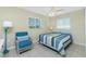 Cozy bedroom features a comfy bed with coastal-themed decor, natural light, and relaxing ambiance at 1910 Greenlawn Dr, Englewood, FL 34223