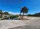 Public boat ramp and small parking area with views of the water and surrounding landscape at 1910 Greenlawn Dr, Englewood, FL 34223