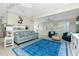 Bright living room with stylish blue accents and open floor plan at 1910 Greenlawn Dr, Englewood, FL 34223