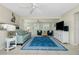 Cozy living room with tile floors and ample natural light at 1910 Greenlawn Dr, Englewood, FL 34223