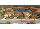 Aerial view of a well-maintained home with mature landscaping and picturesque water views at 209 Malina Ct, Nokomis, FL 34275