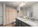 Bathroom features a double vanity with a granite countertop at 23 Fairway Rd, Rotonda West, FL 33947