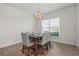 Charming dining room features a modern chandelier and a stylish rug under the dining table at 23 Fairway Rd, Rotonda West, FL 33947