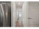 Hallway featuring wood floors and a view of the bedroom at 23 Fairway Rd, Rotonda West, FL 33947