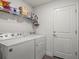 Bright laundry room equipped with a washer and dryer at 23 Fairway Rd, Rotonda West, FL 33947
