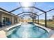 Inviting pool and spa area with a screened enclosure, perfect for enjoying the Florida sunshine at 23 Fairway Rd, Rotonda West, FL 33947