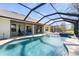 Gorgeous pool area with a screened enclosure, offering a relaxing outdoor space with ample seating at 23 Fairway Rd, Rotonda West, FL 33947