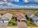 Discover this home's charm with a red tile roof, brick driveway, and two-car garage at 26636 Irwin Dr, Englewood, FL 34223