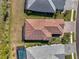 An aerial perspective displays the home's layout, including a patio, tile roof, and driveway at 26636 Irwin Dr, Englewood, FL 34223