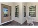 Inviting home entrance with a glass door and lots of natural light at 26636 Irwin Dr, Englewood, FL 34223