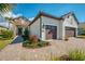 Beautiful exterior with a two-car garage and a beautifully manicured lawn at 26636 Irwin Dr, Englewood, FL 34223