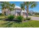 Beautiful exterior with a two-car garage and a beautifully manicured lawn at 26636 Irwin Dr, Englewood, FL 34223