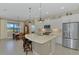 Well-equipped kitchen with stainless steel appliances and a central island with bar seating at 26636 Irwin Dr, Englewood, FL 34223