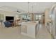 Spacious kitchen with stainless appliances overlooking the adjacent living room at 26636 Irwin Dr, Englewood, FL 34223