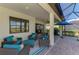 The covered patio provides a nice seating area and outdoor dining with relaxing scenery at 26636 Irwin Dr, Englewood, FL 34223