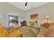 Inviting sitting room offering natural light and seamless access to the kitchen at 26636 Irwin Dr, Englewood, FL 34223