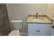 Bathroom featuring a shower with tile surround, granite counters and white cabinets at 5055 N Beach Rd # 203, Englewood, FL 34223