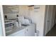 Community laundry room with coin operated washer and dryer machines at 5055 N Beach Rd # 203, Englewood, FL 34223