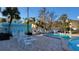 Relax by the pool with lounge chairs and a grill perfect for outdoor gatherings and summertime fun at 5055 N Beach Rd # 203, Englewood, FL 34223